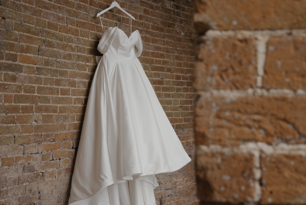 Ria's dress hanging gracefully on the wall outside Crowcombe Court, Somerset