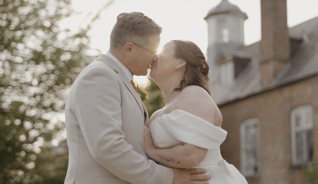 Rich and Ria share a romantic kiss in front of Crowcombe Court, Somerset, with golden sunset light streaming between them
