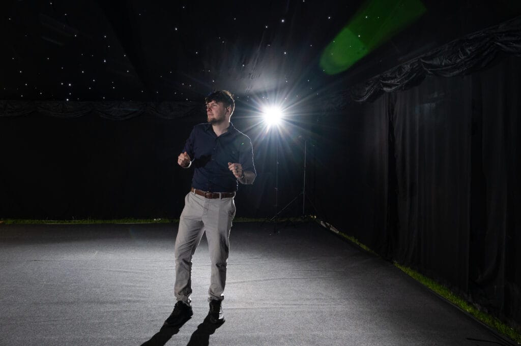 chris of diamond film on stage at wedding reception